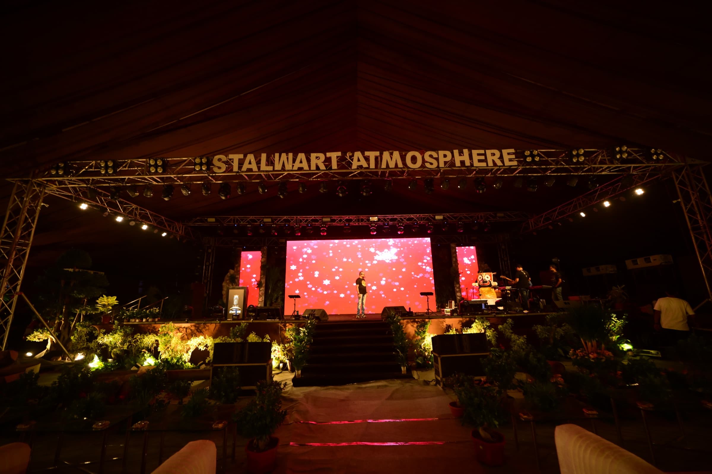 Event stage production with colourful lighting and live performance